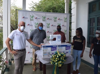 Carib Cement donates sewing machines to community groups   